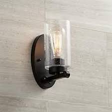 The north woods trout is depicted on this rustic wall sconce. Holman Bronze 9 3 4 High Seedy Glass Wall Sconce Bronze Wall Sconce Wall Sconce Hallway Bathroom Wall Sconces