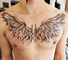 Black and grey wings tattoo on man chest. Pin On Tattoo S
