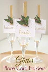 Craft paint (i used gold metallic paint from martha stewart) painter's tape and a small paint brush. Glitter Clothespin Place Card Holders Catch My Party
