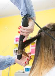 See more ideas about ombre hair, hair, hair styles. Professional Hairdresser Curling Ombre Hair With Iron In Beauty Salon Stock Photo Picture And Royalty Free Image Image 71944127