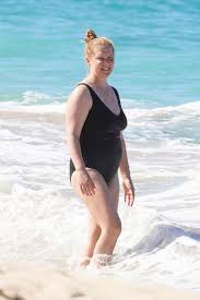 During her 2019 netflix special growing, amy schumer revealed that her husband, chris fischer, is on the autism spectrum. Amy Schumer Rocks Black Swimsuit On St Bart S Beach At Christmas Hollywood Life