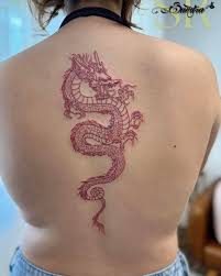 There's something so powerful about a dragon in red. 🐉 Fine line detail  flowing down the spine—elegant, fierce, and full of meaning. This piece was  such a joy to create! ❤️ 𝐅𝐨𝐫