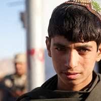 Members of Arbakai listen as Mohammed Ullah, the leader