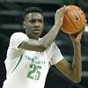 Toronto raptors forward chris boucher looks on as the larry o'brien trophy sits on a table in an outdoor basketball court during a homecoming visit to montreal on friday following the raptors' nba championship win over the watch | raptors champion chris boucher returns to montreal 1