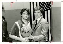 Suffolk University men's basketball coach James E. Nelson with a player,  1979-1980