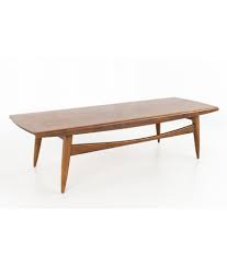 Provide a spectacular new centerpiece for your modern living room with the. Mid Century Modern Walnut Danish Style Surfboard Coffee Table