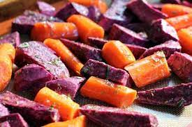 Roasted Purple Sweet Potato Wedges With Rosemary And Thyme One Hundred Dollars A Month Purple Sweet Potatoes Sweet Potato Wedges Sweet Potato Recipes