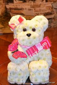 A unique teddy bear made out of fresh chrysanthemum, long lasting and simply to cute to resist. Flowertoy Teddy Bear Bear Made From Fresh Flowers Animal Flower Arrangements Flower Toy Floral Art