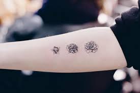 Small Flower Tattoo Cute Fine Line Watercolor Unique Different Girly Cool Idea Black And Grey Cool Tattoos Tattoos For Daughters Small Flower Tattoos