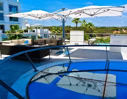 relax and refresh yourself under tuuci s ocean master max dual cantilever while sitting on the rooftop deck of the c outdoor spaces rooftop deck ocean master