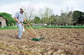 Choose The Right Garden Seed Planter Sustainable Farming Mother Earth News Seed Planter Sustainable Farming Garden Seeds