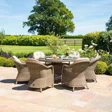 Find the perfect home furnishings at hayneedle, where you can buy online while you explore our room designs and curated looks for tips, ideas & inspiration to help you along the way. Winchester Heritage 6 Seat Round Fire Pit Dining Set With Lazy Susan Outdoor Living From Breeze Furniture Uk