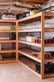 This loft style garage shelving setup allows you to utilize the top portion of your garage walls that would once the plywood is attached to all of the shelves, you can either paint them start putting them to (most homes built after 2000 do.) if you attach anything to hang beneath them, the warranty on. Diy Basement Shelving The Wood Grain Cottage