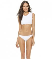Why Non Revealing Swimsuits Are The Hottest Look Of The Summer Bikinis Revealing Swimsuits White Bikini Tops