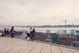 Bring some snacks or a light lunch, and there's a booth on top of the hill that sells beverages including beer and wine. Miradouro De Santa Catarina Lisboa Portugal Living In Iberia