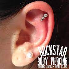 This Helix Piercing Is Showcased By An Anatometal Gem Cluster These Clusters Can Be Used For Several Different Placement Helix Piercing Body Piercing Piercing
