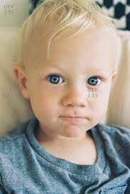 I won't deny, a proper natural blonde (with the fair, lightly freckled pinkish skin) can be special, but so can a brunette with dark eyes, or a redhead with green eyes, or any other girl with any other colouring. Portrait Of A Toddler Boy With Blonde Hair And Blue Eyes Stock Photo Offset