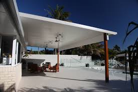 A patio roof creates an outdoor living room, perfect for dining, having drinks with friends, or just relaxing with a book. Insulated Roof Solarspan Patios And Pergolas With Comfort Style Designing A Pergola Patio Ideas Solarspan Insuated Patio Roofing
