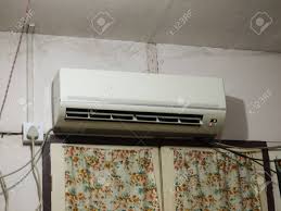 In the air inlet and outlet vents. Color Photo Of Split Type Air Conditioner Mounted On Wall Stock Photo Picture And Royalty Free Image Image 78224175