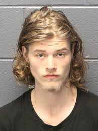 Suspect charged after shots fired at woman in attempted robbery, police say