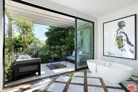 Since june, the youngest of the kardashian/jenner clan has bought a $6 million mansion and the $4.5 million house next door. Kylie Jenner And Travis Scott Buy 18 7m Beverly Hills Home Together
