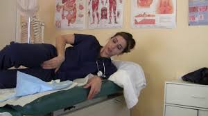 Patient and doctor in the gynecologist's office: Nurse Carol Examines Deborah