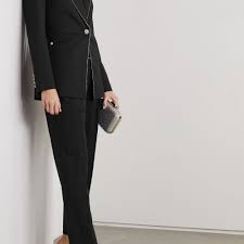 With a high neck, sleek silhouette and modern back, this slinky beaded gold dress is simply chic. 20 Best Mother Of The Bride Pantsuits Of 2021