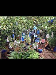 Omg By Juliette Features In This Garden Glass Garden Ornaments Hanging From The Central Bay Tree See More At Www Om Garden Ornaments Glass Garden Garden Art