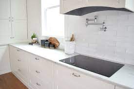 White Modern Farmhouse Kitchen With Wavy White Subway Tile Backsplash Chro Country Kitchen Backsplash Subway Tile Backsplash Kitchen White Subway Tile Kitchen Whether its your kitchen floor or porcelain tiles to the bathroom you will learn how to lay them if the wall is undulating (very wavy) you will need to reduce the size of the tiles to follow the curves on the.