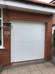 Is the big button on the wall control station blinking? Seceuroglide Roller Garage Doors New Security