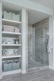 The rough brick wall and unfinished wood table of this space contrast with the smooth, geometrical look of the washbasin and mirror. Roeser Homes Wurde Von Anfang An Von Einer Einfach Anfang Einer Einfach Homes Ro Basement Bathroom Remodeling Bathroom Design Bathroom Remodel Master