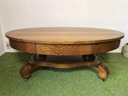 32 cocktail coffee table oval metal base antique brass finish white stone top. Vintage Tiger Oak Oval Coffee Table With Long Drawer And Casters 44w X 27d X 16 5h