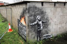 We hung up some decorators' signs. Banksy Gifts Welsh Steel Town A White Christmas Attraction