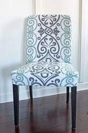 They are designed to fit fairly closely over your chairs but don't require any zippers or ties. Diy Dining Chair Slipcovers From A Tablecloth Slipcovers For Chairs Dining Room Chair Slipcovers Diy Dining Chair Slipcover