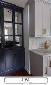 This grey kitchen cabinetry adds a very modern and personalized slant on the traditional dark cabinet trend. Grey Kitchen Cabinets White Countertops Design Ideas