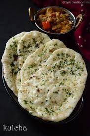 Kulcha A North Indian Style Flat Bread Which Is Often Baked In Tandoor Oven And Most Sought After Main Order Kulcha Recipe Indian Food Recipes Paratha Recipes