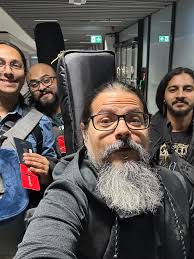 Just landed in Germany and the immigration officer asked what band, then he  looked us up