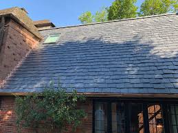 Slate roof tiles add plenty of grandeur to a building. Slate Roofs Welte Roofing