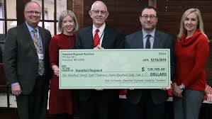 Hannibal Regional Auxiliary presents check to HRH