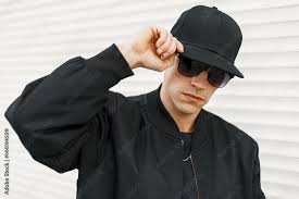 black baseball cap posing ...