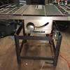 10 portable table saw with fold and roll stand. 1