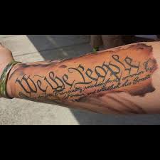 Behind the text, you can mimic the american flag by using one color or even all which are on the flag. 140 Patriotic We The People Tattoo Designs With Meaning And Ideas Body Art Guru