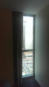 The wall system begins with flashing at the bottom of the wall, which collects water that drains down the wall and kicks it out at the base. Very Narrow Window At Edge Of Wall With Uninteresting View Picture Of Club Quarters Hotel World Trade Center New York City Tripadvisor
