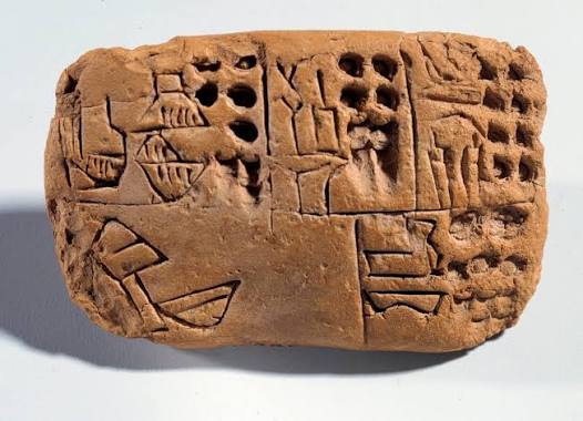 Mesopotamia: tablilla de tierra cruda con inscripción cuneiforme. Región de  Sumer. 3300 a.C. París, Museo del Louvre