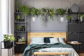 Plants And Lamps Above Wooden Bed With Green Blanket In Grey Bed Bedroom Interior Bedroom Inspirations Grey Room