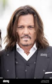 Johnny depp 76th annual cannes film hi-res stock photography and images