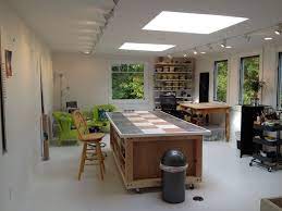 We Had A Storage Room Above Our Garage Converted Into My New Art Studio We Added 2 Skylights More Windows And Lot Garage Art Studio Art Studio Lighting Home