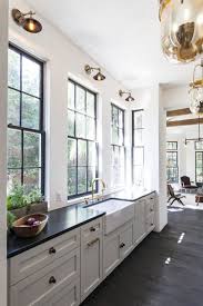 Windows Black Counters Brass Lights Little Bump Out Wall Delineating Space Kitchen Cabinet Design Home Decor Kitchen Kitchen Design