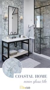 A traditional master bathroom has a modern feel with clean white subway tiles and herringbone mosaic. Beachy Keen Coastal Home Decor Inspiration Glass Tile Glass Tile Design Glass Tile Bathroom