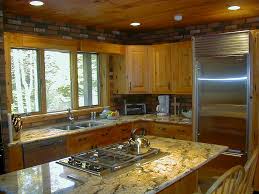 Rustic kitchens might be the most fun to design because you can get away with all kinds of cabinets. A Knotty Pine Paradise Categorized Under Transitional Kitchen Portfolio